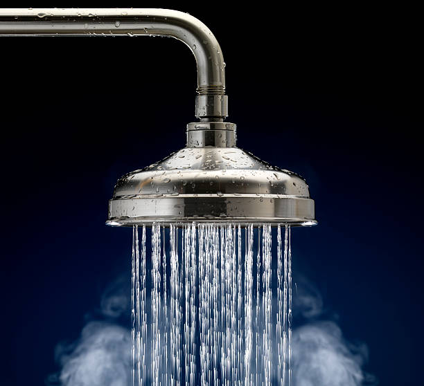 Shower Head with water droplets and steam, isolated stock photo