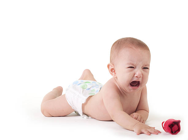 Baby crying on white stock photo