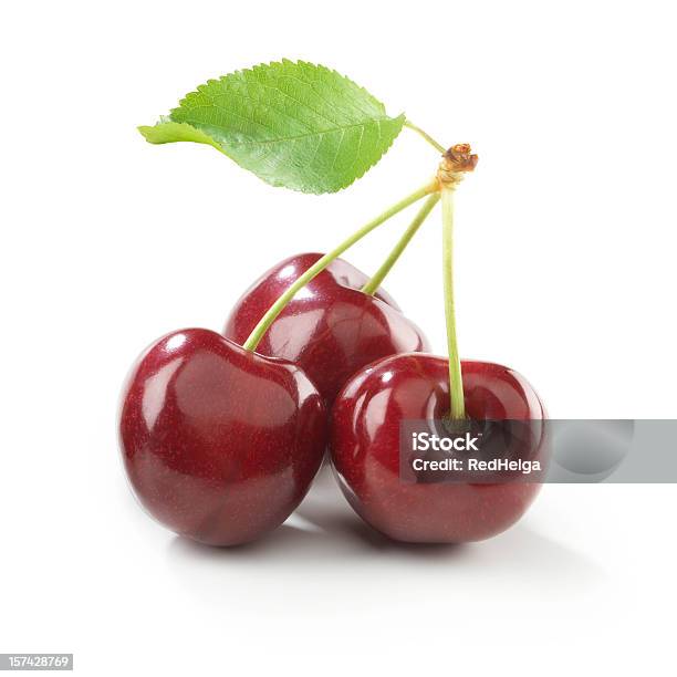 Cherry Trio With Stem And Leaf Stock Photo - Download Image Now - Cherry, Cut Out, White Background