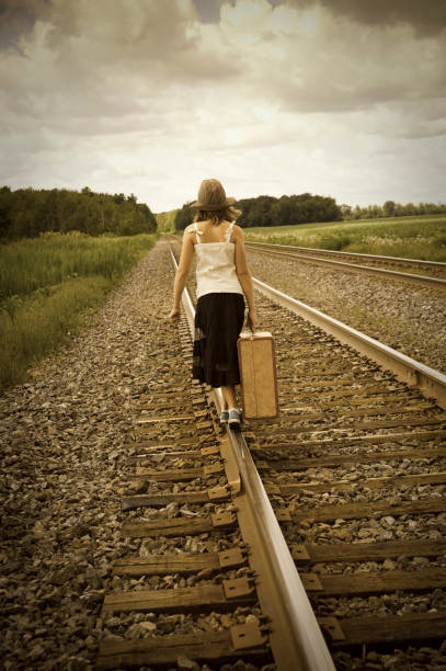 istock Old fashioned kids on a railroad 157428848