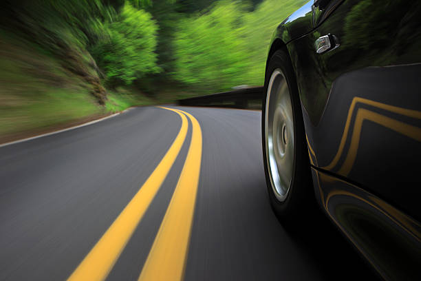 Speeding  driving winding road stock pictures, royalty-free photos & images