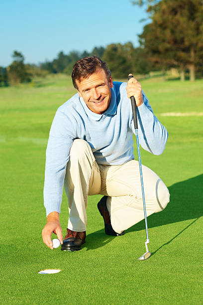 istock Happy handsome golfer during a game of golf 157429111