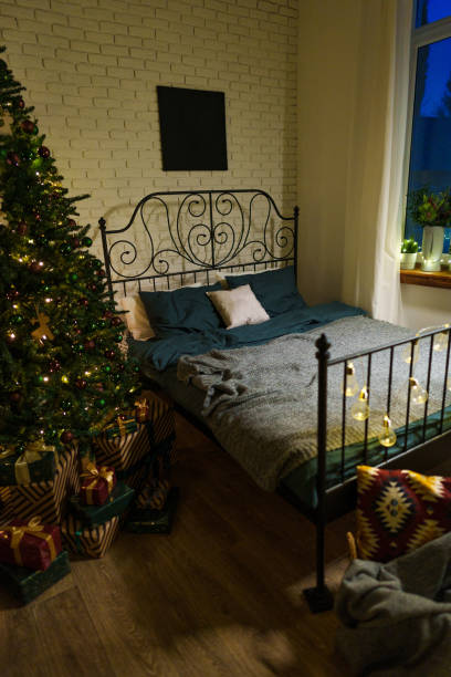 istock Cozy bedroom interior with winter Christmas decorations 1574291211