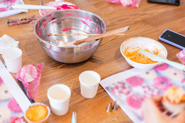 istock Latina woman teaches dessert workshop with colored meringue 1574292313