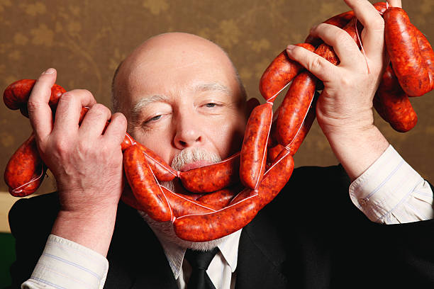 Man smelling chorizo.