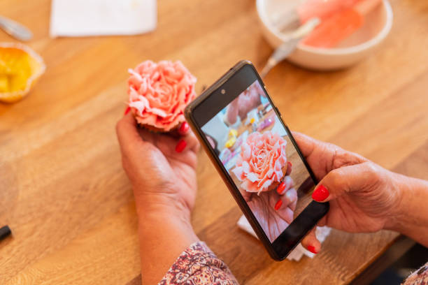 istock Latina woman teaches dessert workshop with colored meringue 1574294089