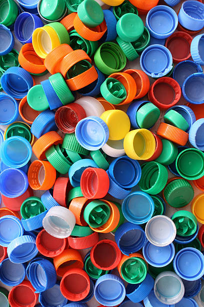 Plastic caps background Top view of colorful plastic caps bottle cap stock pictures, royalty-free photos & images