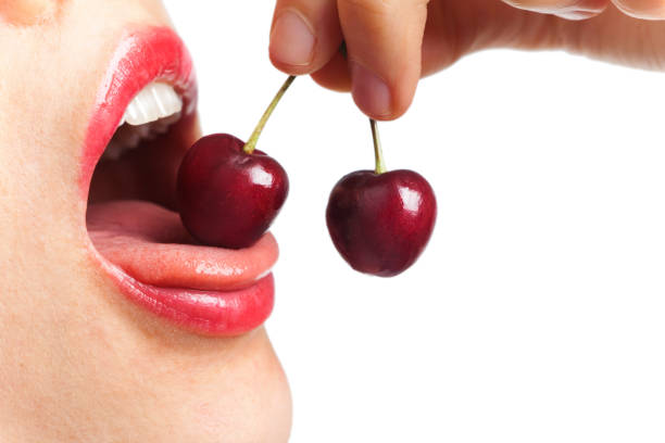 istock Girl eating cherries 157429538