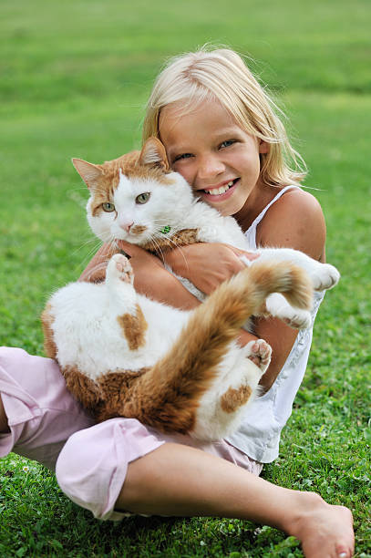 istock Little girl with her cat 157429634