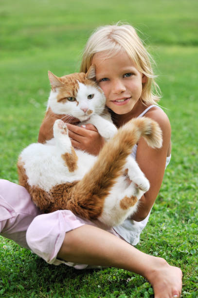 istock Little girl with her cat 157429646