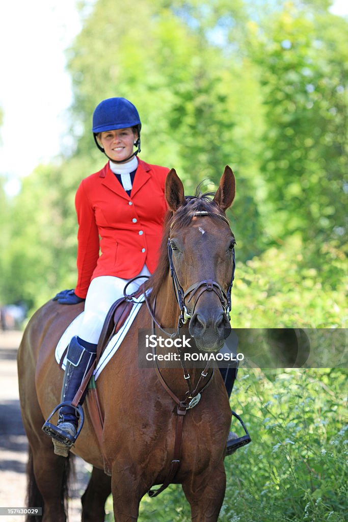 Happy teenager horseback riding and dressed for competition  Formalwear Stock Photo