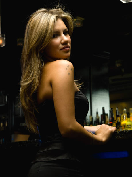 istock Young Woman at the Bar 157430074