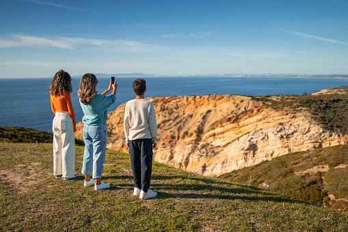 Tourists on the cliff of Cabo Espichel in Sesimbra, Setúbal, Portugal