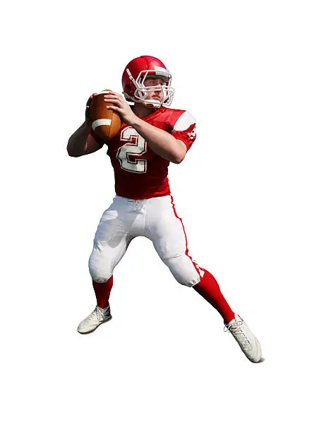 Quarterback dropping back to pass. Isolated on white with drop shadow and clipping path.