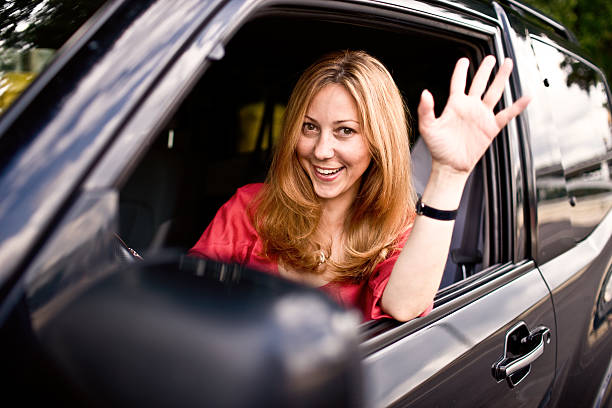 istock Young Woman Sitting in Car with Window Rolled Down 157430527