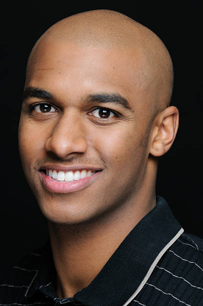 istock Headhsot of young smiling black man 157430597