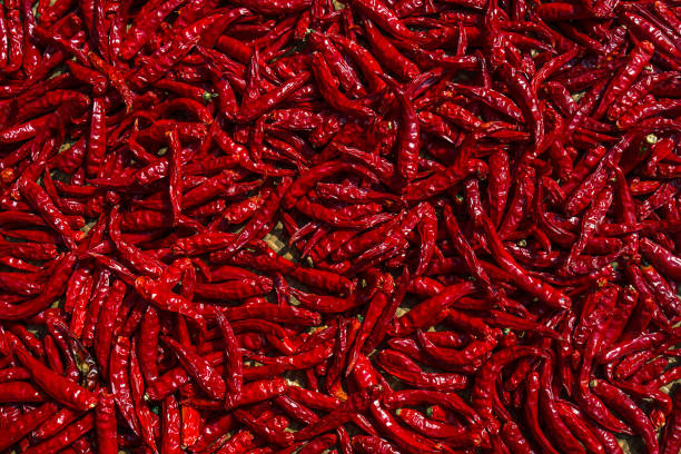 istock Texture of dried red chili peppers. 1574311525