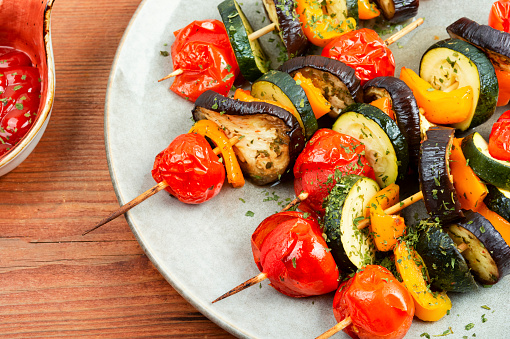 Vegetable skewers with peppers, eggplant and cherry tomatoes. Summer barbecue.