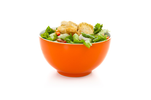 Salad in bowl on white background