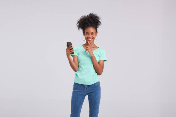 istock Digital Diva: Thai American Woman's Smartphone Studio Fashion 1574314760