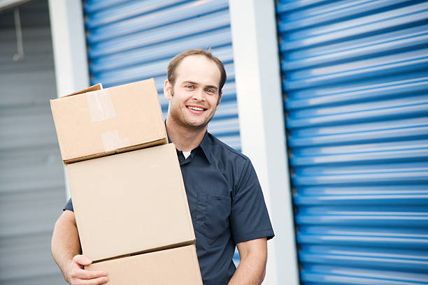 Man with Boxes Moving Company at Self Storage stock photo