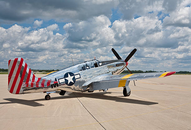P51 Mustang WW2 Fighter plane two a p51 mustang, authentic but restored and decked out in chrome. p51 mustang stock pictures, royalty-free photos & images