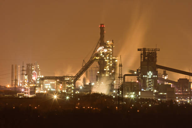 Telephoto shot of a large steel mill at night.