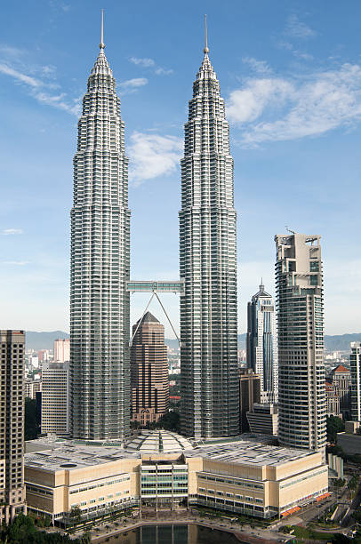 Petronas Towers in Kuala Lumpur The iconic twin towers in Malaysia's capital city. twin towers malaysia stock pictures, royalty-free photos & images