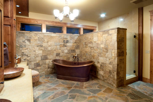 istock Stone wall and floor bathroom with brown freestanding bath 157431723