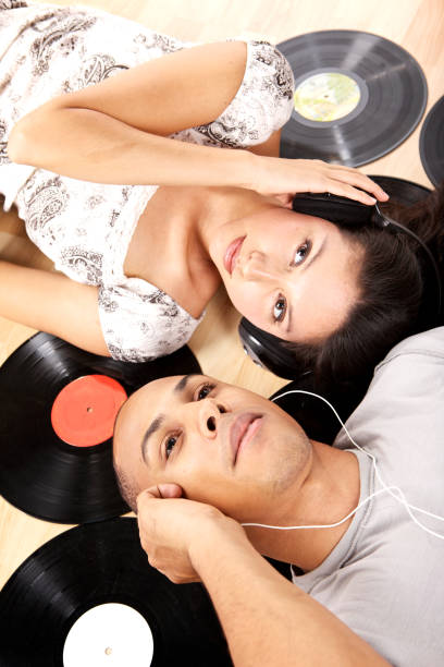 dried red rose. dry rose and CD player. dry rose lies on a portable compact disc player