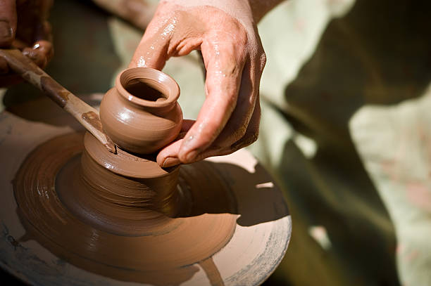 istock potter makes a jug out of clay 157432981