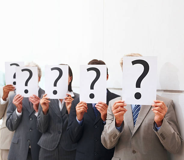 istock Business people holding ? Place cards over their faces 157433108