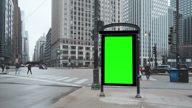 Green mock up blank vertical billboard on the city street for advertisement in Chicago, Illinois, USA