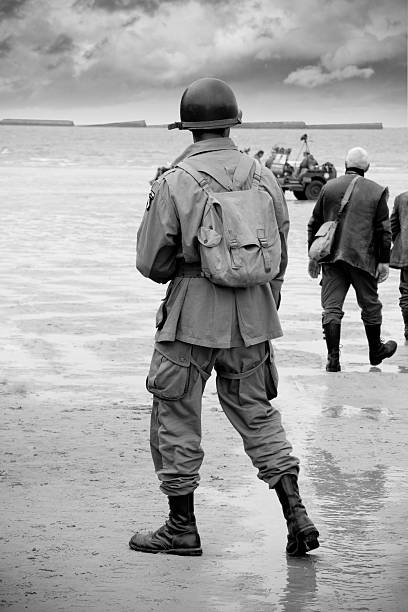 Soldier on beach at D-Day stock photo
