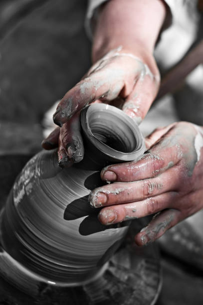 istock potter makes a jug out of clay 157433393
