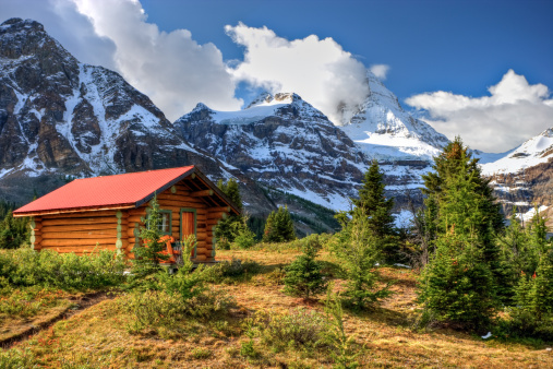 A beautiful cabin in the Rocky Mountains of Canada. Mount Assiniboine in the background.