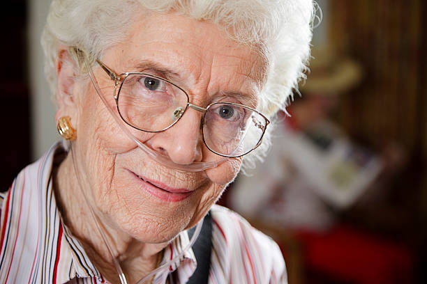 istock Senior Citizen Woman with Oxygen Tube 157433779
