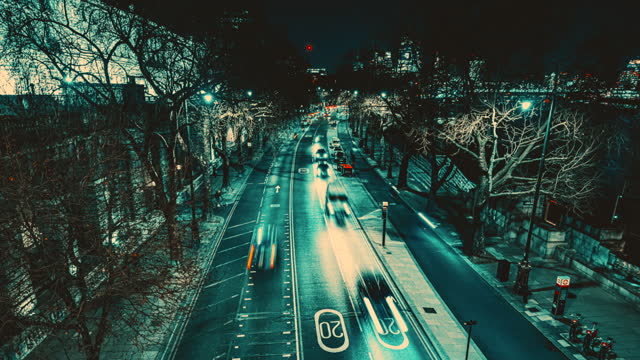Traffic travelling on multiple lane thoroughfare at night, London