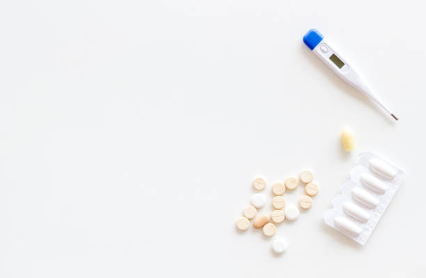 istock Medical treatment concept with thermometer pills and rectal suppositories 1574340685