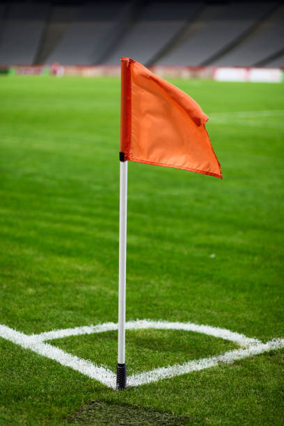Corner of a soccer field at night.
