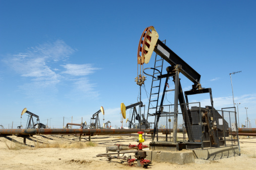 Lost Hills Oil Field pumpjack, with others in background.