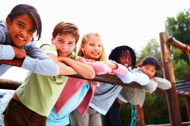 istock Happy boys and girls leaning on railing 157434213