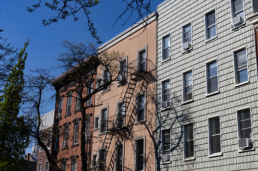 A row of beautiful and colorful old brick apartment buildings in Williamsburg Brooklyn of New York City