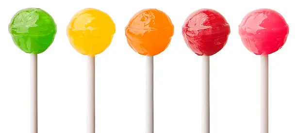 Five delicious lollipops isolated on white.
