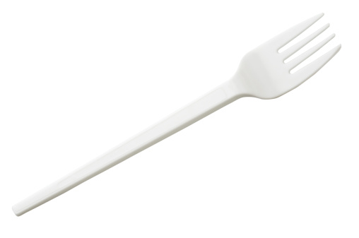 Plastic fork isolated on white.