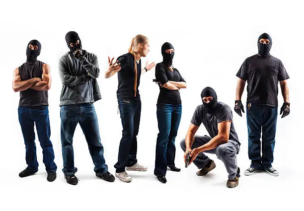 6 robbers showing different personalities, shot in studio on a white background.