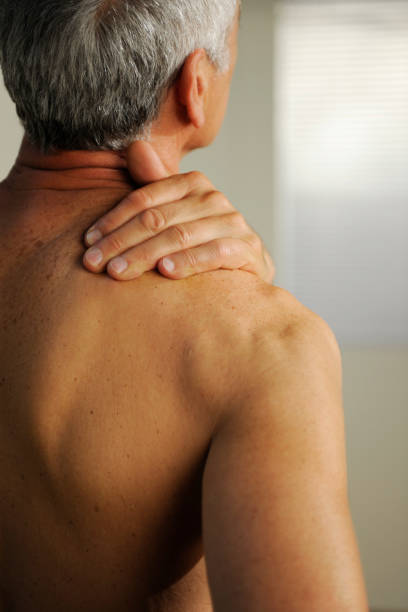 istock senior with neck pain 157434541