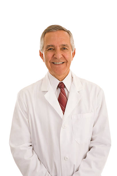 istock Smiling senior male wearing lab coat hands in pocket 157434703