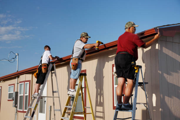 istock Three Men Installing Seamless Aluminum Gutters on Home 157434729