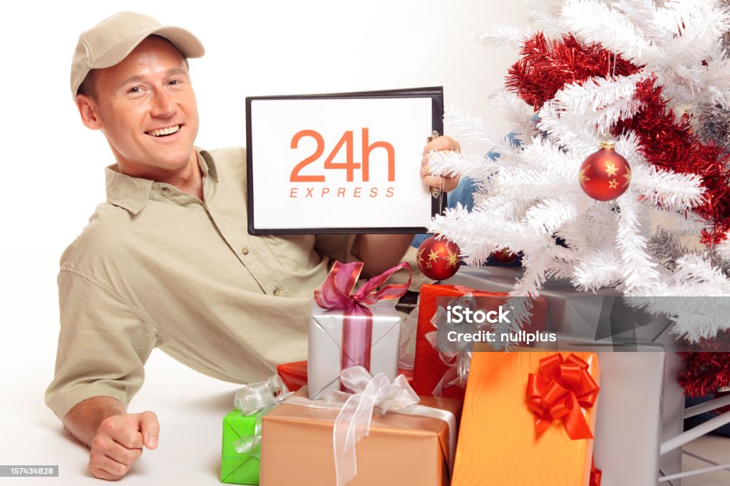 24 hour express delivery, even on christmas! this delivery boy will work on x-mas, just to bring you your gifts in time. Blue-collar Worker Stock Photo